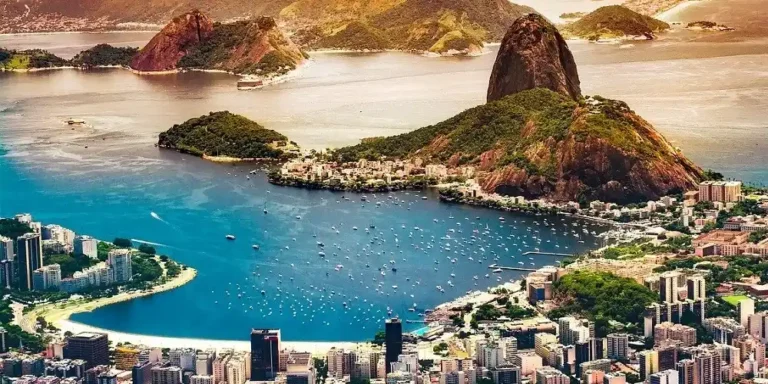 Aerial view of Rio de Janeiro with Guanabara Bay, Sugarloaf Mountain and surrounding hills.