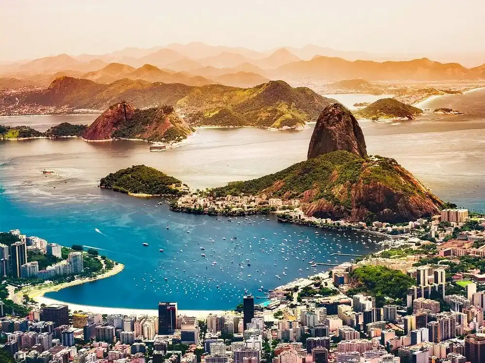 Aerial view of Rio de Janeiro with Guanabara Bay, Sugarloaf Mountain and surrounding hills.