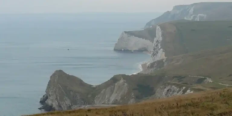 View across the rugged cliffs and coastline of Lulworth on England’s Jurassic Coast in South England.