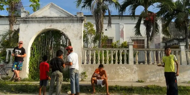 Freemason lodge in Aracataca Colombia with locals outside, reflecting real life behind Macondo.